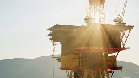 An offshore oil platform at sunset light Stock Footage 118815474