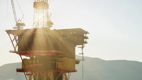 An offshore oil platform at sunset light Stock Illustration