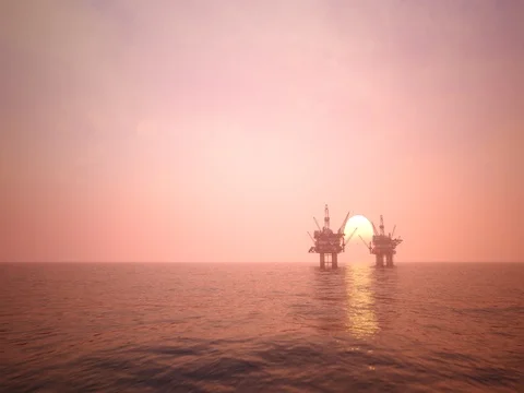 Offshore oil platforms during sunset Video stock 77743445