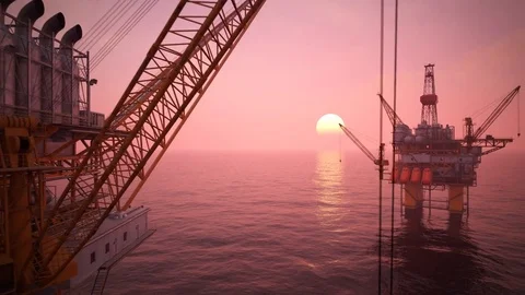 Offshore oil platforms during sunset Vídeos de archivo 77747940