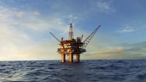 Offshore oil rig platform with derrick and cranes in ocean Stockbeeldmateriaal 82806762