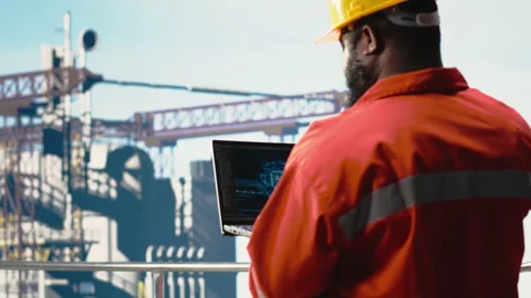 Offshore platform crew using artificial intelligence program on laptop Stock Footage 319970906
