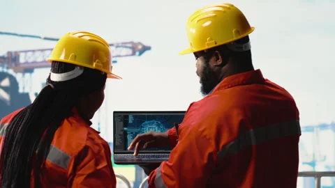 Offshore platform crew using artificial intelligence program on laptop Stock Footage 319971150