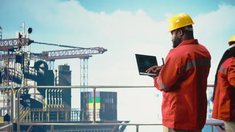 Offshore platform crew using artificial intelligence program on laptop Stock Footage 319973689