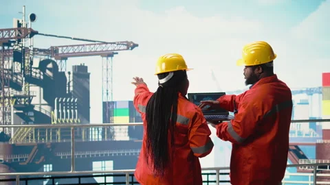 Offshore platform crew using artificial intelligence program on laptop Stock Footage 319975566