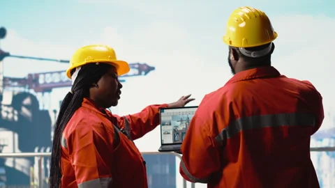 Offshore platform employees use management software to observe operations Stock Footage 319971649