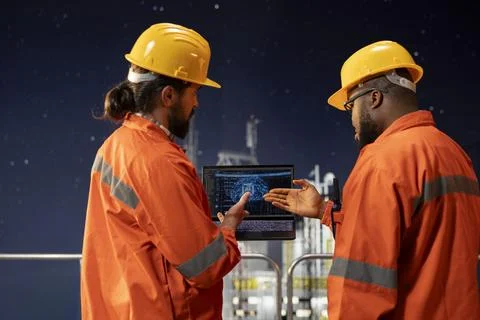 Offshore platform engineering team using predictive AI models Stock Photos