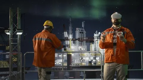Offshore platform workers using VR headset to monitor fuel shortages 스톡 사진