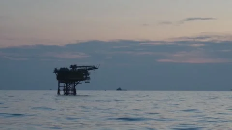 Offshore Production Platform View from Crew Boat at Dusk Stockbeeldmateriaal 348253455