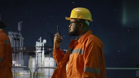 Offshore rig radio operators coordinate safe supply routes during oil crisis Stock Photos