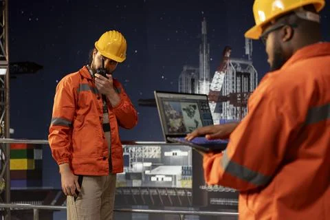 Offshore sea platform crew experts use laptop to survey geological data Stock Photos