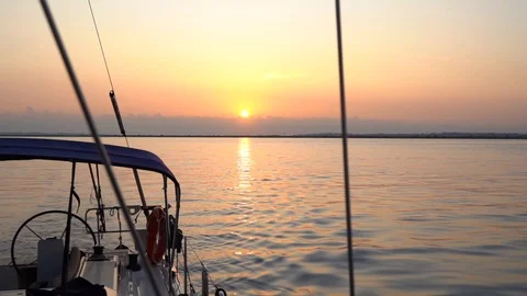 Offshore sunset view from a deck of sailing yacht Stock Footage 120257950