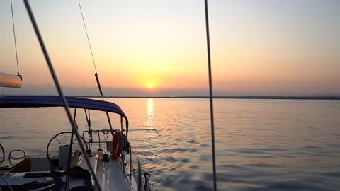 Offshore sunset view from a deck of sailing yacht Stock Footage 120258020