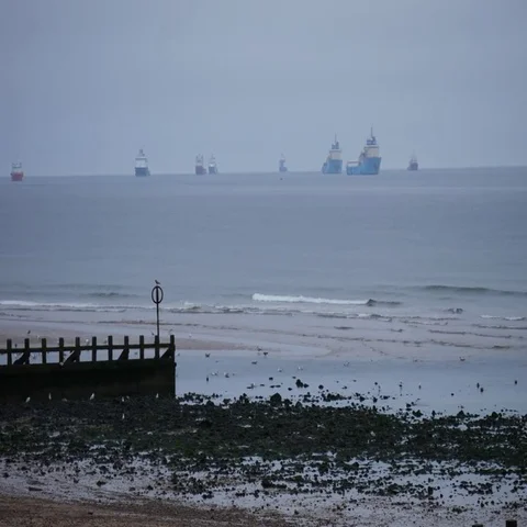 Offshore supply boats floating in the North sea close to Aberdeen beach Stock Footage 69529400