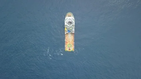 Offshore Supply Vessel For Oil Drilling Rig in The Middle of Ocean Stock Footage 123738653