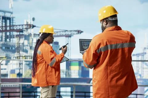 Offshore technician using laptop software to conduct subsea mapping survey Stock Photos
