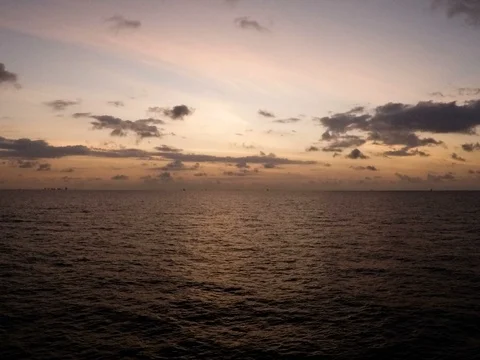 Offshore time lapse sunset day to night Stock Footage 87499801