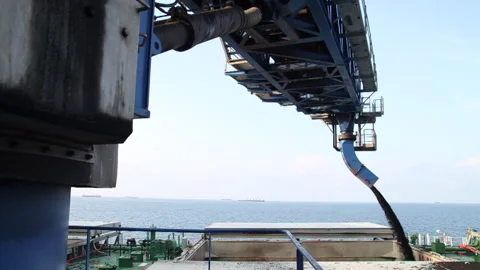 Offshore transfer of coal from barges to cargo ships Stock Footage 147657505