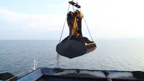 Offshore transfer of coal from barges to cargo ships Stock Footage 147657919