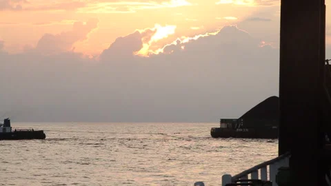 Offshore transfer of coal from barges to cargo ships Stock Footage 147659702