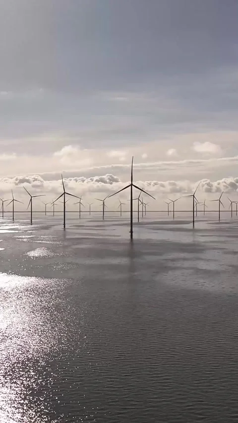 Offshore wind farm generating renewable energy from the sea Stock Footage 327113755