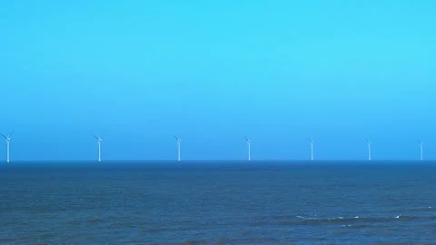 Offshore wind farm producing clean renewable energy Video stock 339434078