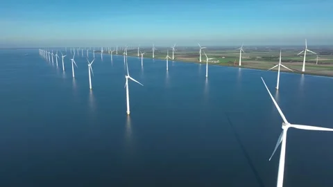 Offshore wind farm at sea and on shore. Aerial view of Windpark Stock Footage 292882773