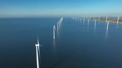 Offshore wind farm at sea and on shore. Aerial view of Windpark, wind turbines Stock Footage 293670934