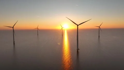 Offshore wind farm in the sea at sunset. Aerial view of  Windpark, wind turbines Stock Footage 293670933