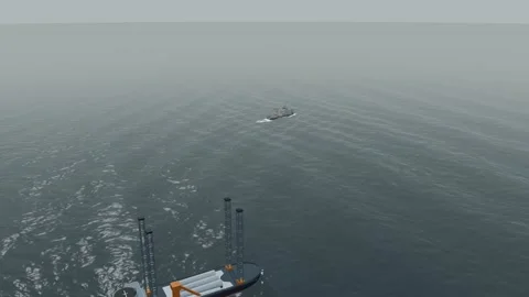 Offshore wind support vessel and jackup rig aerial drizzle and fog tracking 動画素材 343620958