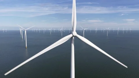 Offshore wind turbine fixed foundation, rotor, blades. Aerial drone video Stock Footage 313252950