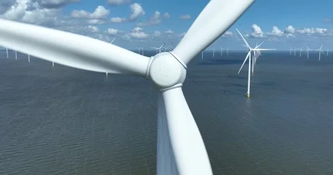 Offshore wind turbine, turning, close up view. Green sustainable energy. Wind Stock Footage 277417359