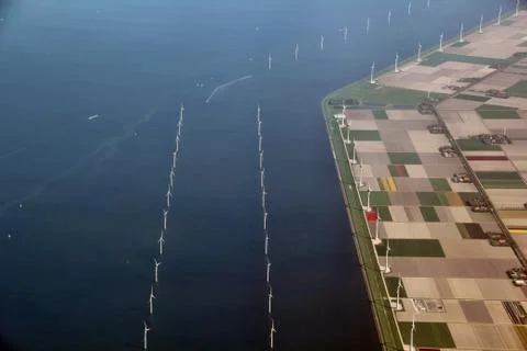 Offshore wind turbine windmill at the coast of the netherlands Stock Photos