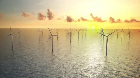 Offshore wind turbines at sunset. Wind Farm, renewable energy. ocean Stock Footage 77500777