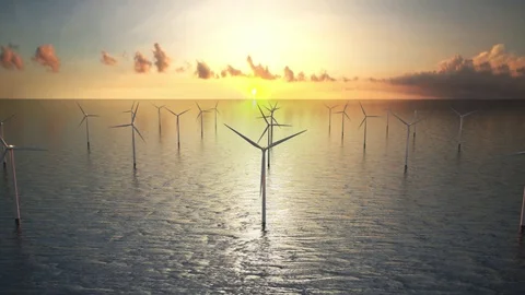 Offshore wind turbines at sunset. Wind Farm, renewable energy. ocean Stock-Footage 77500786