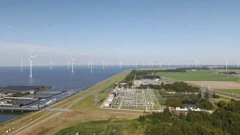 Offshore windfarm and gas fired powerstation and solar panels in the Netherlands Stock Footage 289909562