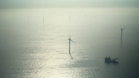 Offshore windfarm and windfarm construction ship at Dutch part of the North sea Stock Footage 289963577