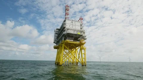 Offshore windfarm high voltage substation in Dutch part of the Northsea Stock Footage 289964289