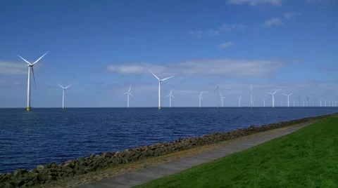 Offshore windpark located along the dikes of the IJsselmeer lake Stock Footage 62594441