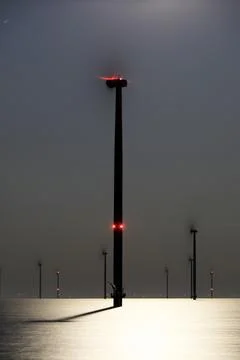 An offshore windpark at night Stock Photos