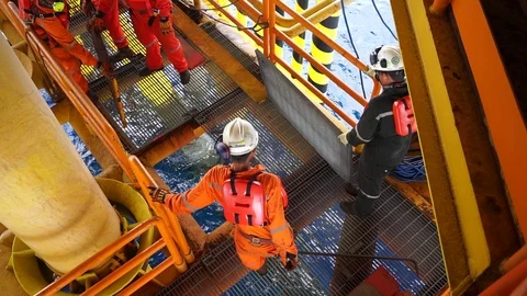 Offshore workers changing new galvanised... | Stock Video | Pond5