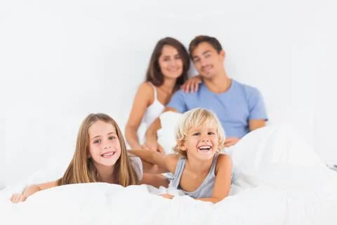 Offspring lying on the bed Stock Photos