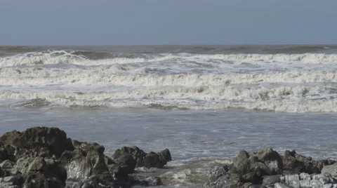 Ogmore-by-Sea, rough surf breaking on the shore. 4K Stock Footage 46225819