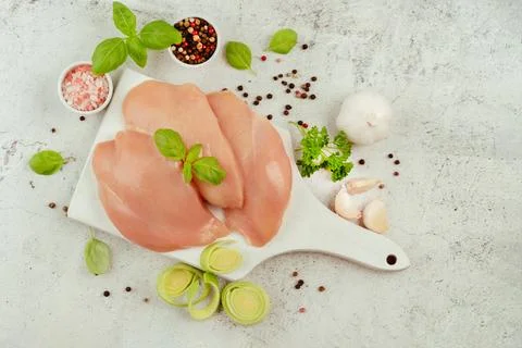 Ogranic food,healthy eating.Food concept.Raw fresh chicken fillet on a gray Stock Photos