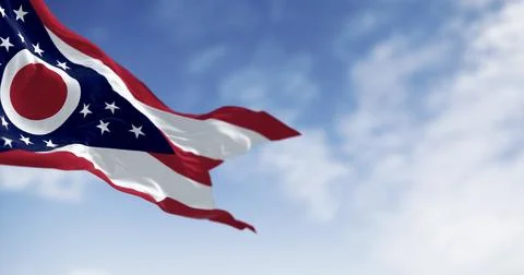The Ohio state flag waving in the wind on a clear day Stock Photos