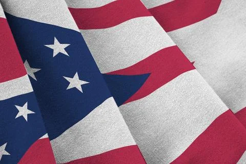 Ohio US state flag with big folds waving close up under the studio light indoors Photos