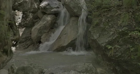 Ohlstadt, Germany, Alpine waterfall in the shadow of forest (BT2100.ST2084) Stock Footage 197052406