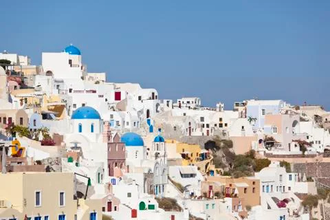 Oia with some chapels, view from the tip to the east in Santorini. Stock Photos
