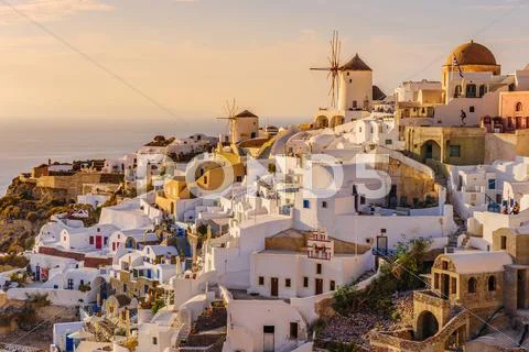 Oia in sunset rays at Santorini, Greece Stock Photos