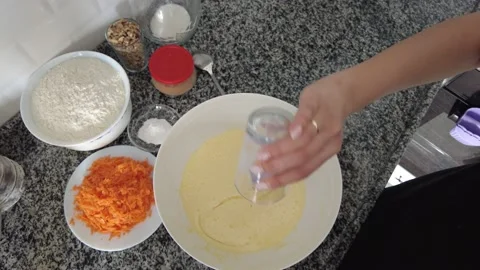 Oil is added to the mixture prepared for baking in the oven. Stock Footage 234752712